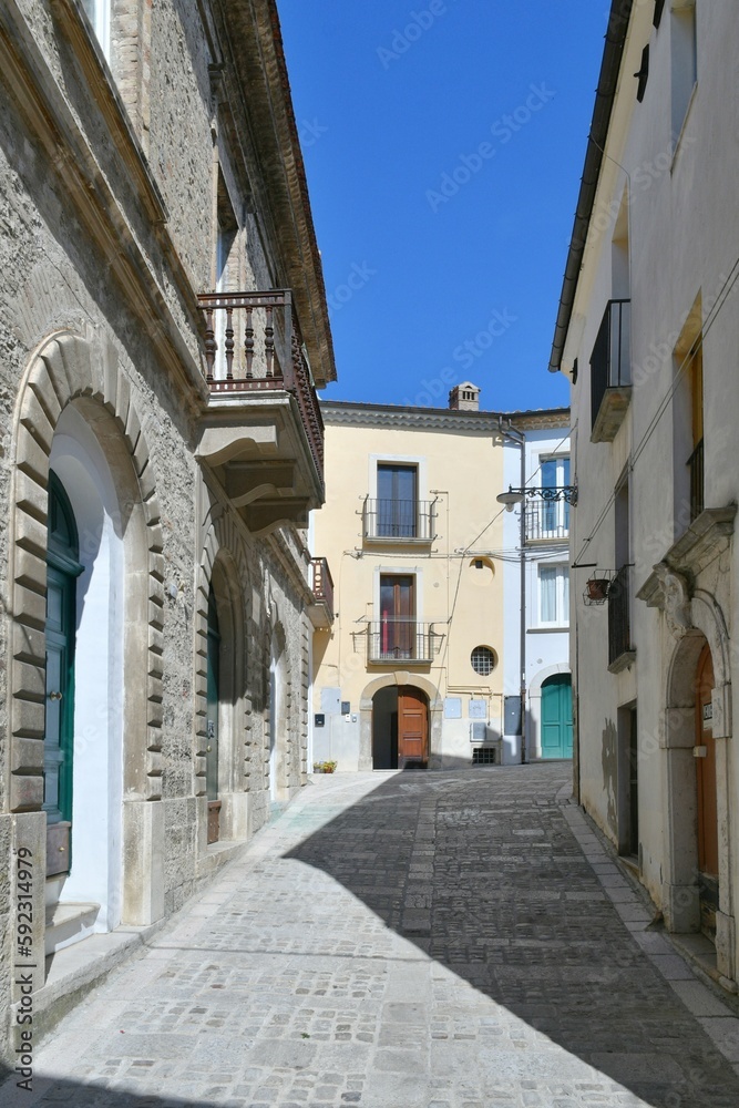 A narrow street among the old houses of Larino, a medieval town in the province of Campobasso in Italy.