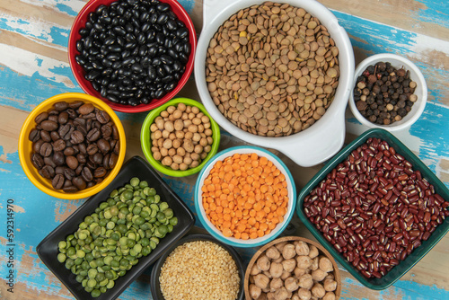 assorted bowls with raw grain and seeds top view