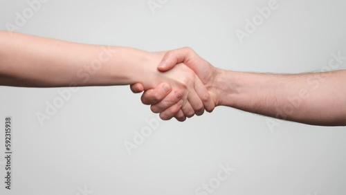 Man and woman shake hands, handshake close up. 4k, slow motion.