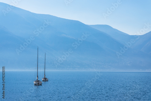 View to beautiful Lago Maggiore surrounded by blue mountains from Ascona, Switzerland