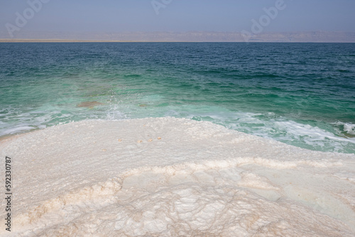 Shore with salt crystalized formation and turquoise water, The Dead Sea, Jordan, Middle East photo