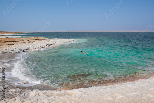 Shore with salt crystalized formation and turquoise water, The Dead Sea, Jordan, Middle East