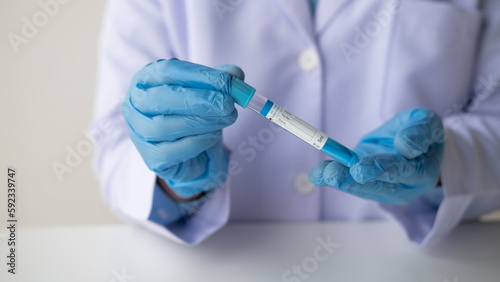 Close up view of Medical or scientific researcher Working With Tubes In Laboratory.