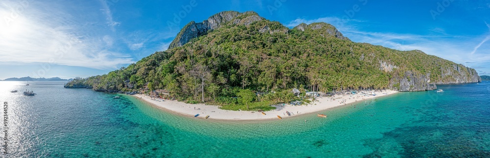 Drone panorama of the paradisiacal Seven Commandos beach near El Nido on the Philippine island of Palawan
