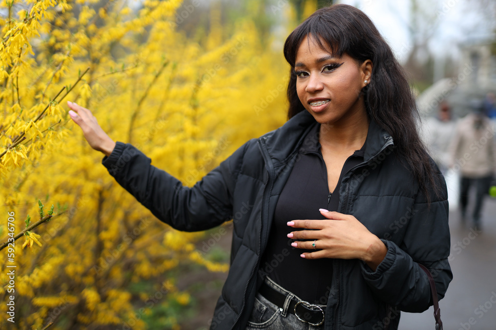 Attractive young African woman and walks in the park. Attractive young African woman and walks in the park.