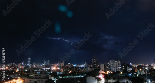 Thunderstorm with lightning in a cloudy sky over the high buildings of city SANTA CRUZ DE LA SIERRA - BOLIVIA  © robertokenapp