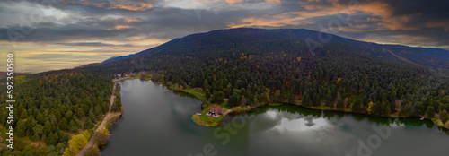 Aerial view of wooden Lakehouse inside the forest in Bolu Golcuk National Park.Bolu Aerial Photo, Turkey. Shooting with drone