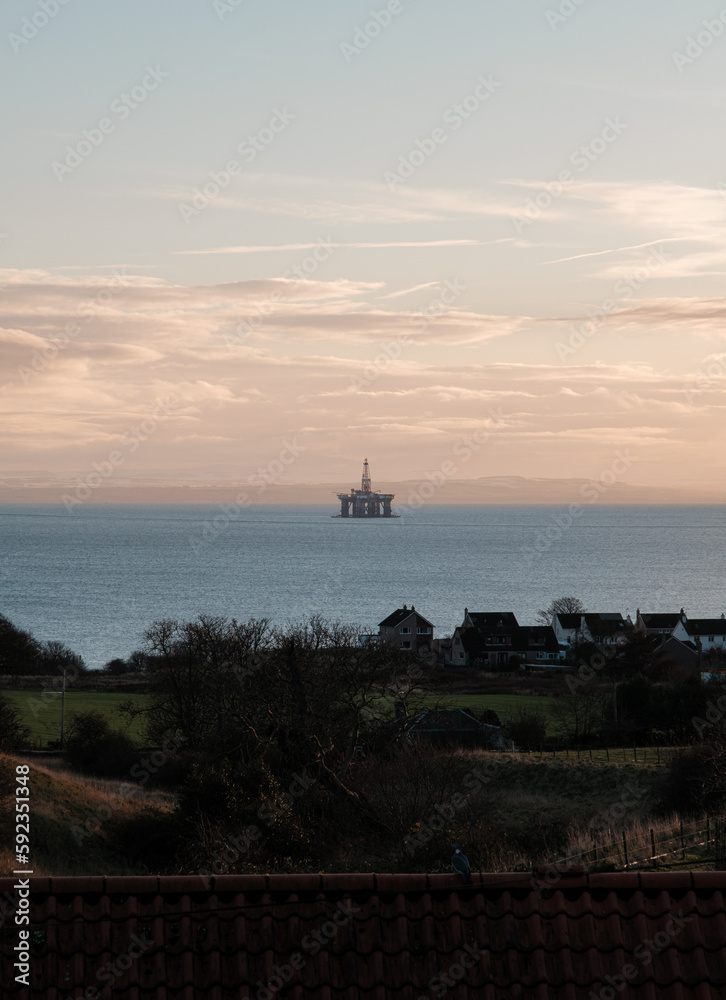 oil platform at dusk of the coast of Scotland