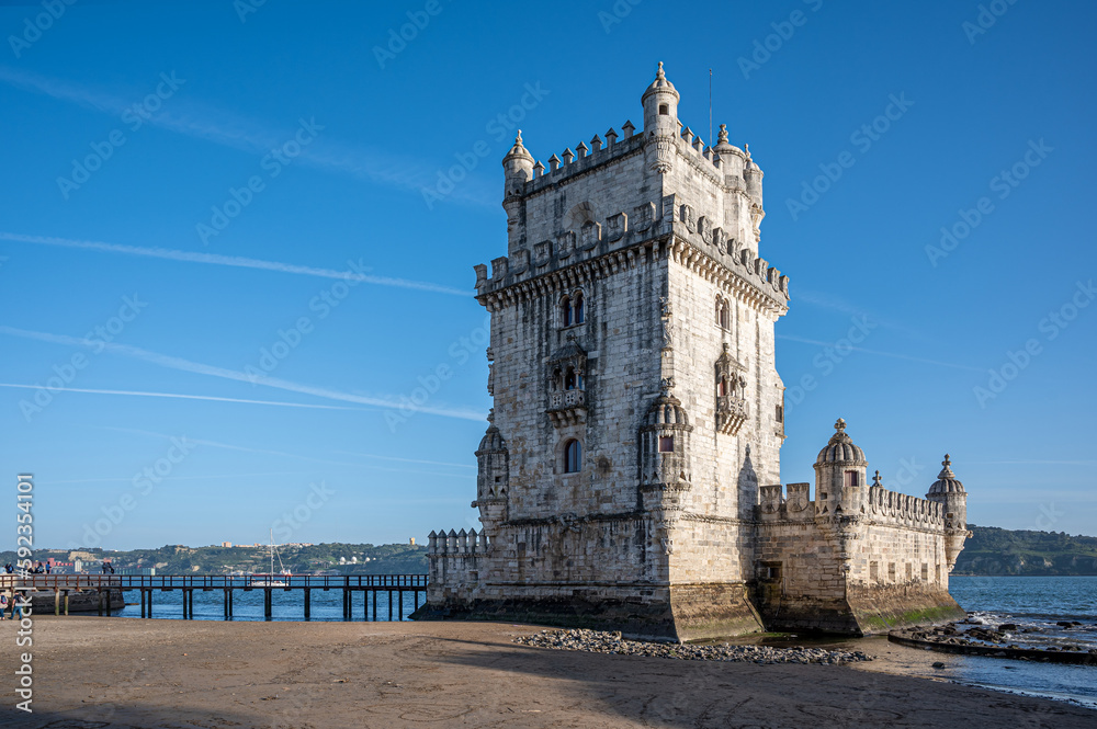 Belem tower and wooden pier during day in Lisbon, Portugal