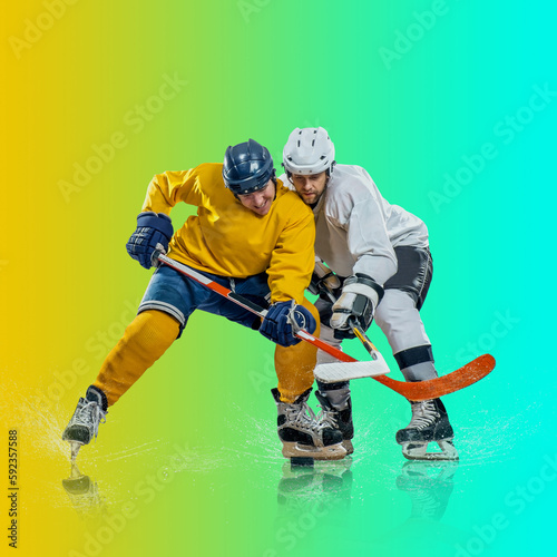 Canvas Print Professional ice hockey player hitting puck for winning goal in action on gradient multicolored neon background