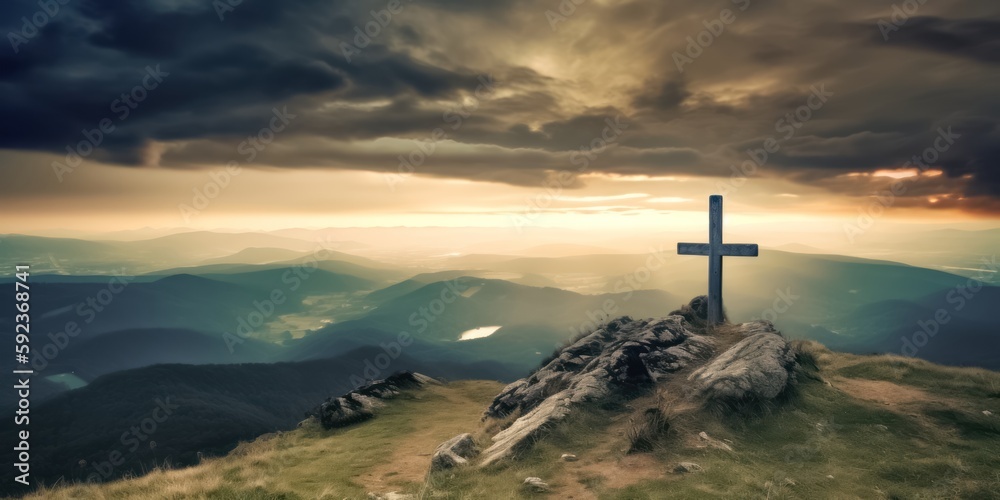 Fototapeta premium A Cross Silhouetted Against a Colorful Mountain Sunset