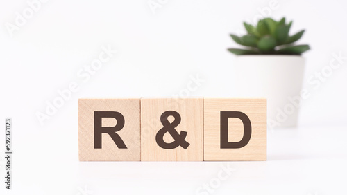 r and d text on wooden cubes. white background. business concept