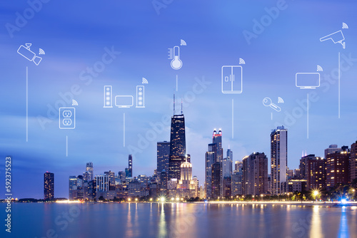 Illustrations of smart devices (internet of things) over city skyline at night, Chicago, Illinois, USA photo