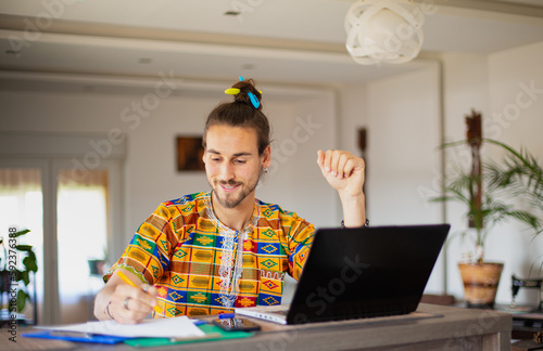 Long hair man working from home