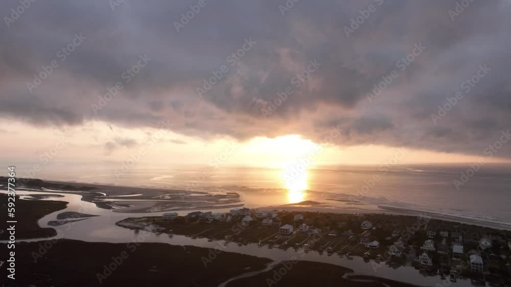  Vacation along South Carolina shoreline with sunrise over beach front property at North end of Pawleys Island