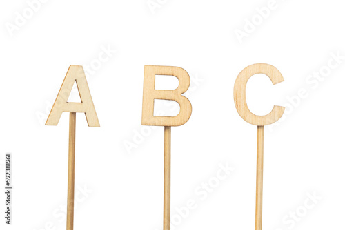 Individual wooden letters forming an ABC isolated on a white background