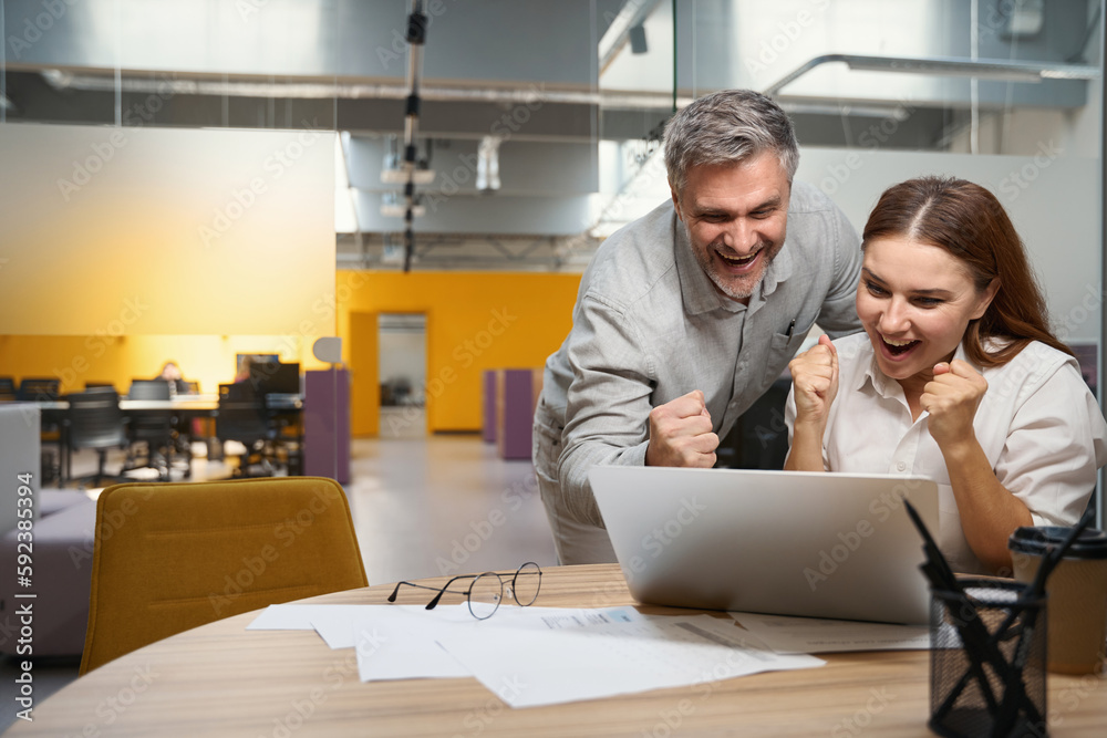 Workers discussing work process in the office