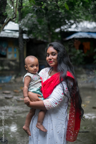 Photography South asian family photo, young mother holding her son, aunt with nephew