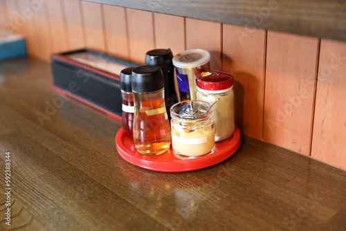 Ramen seasonings on the counter table in ramen restaurant.