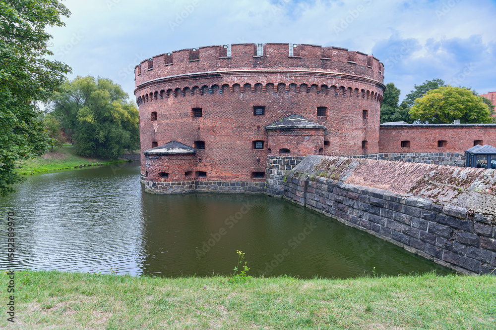 ancient round watchtower and fortress walls of the fortress in the Russian city of Kaliningrad