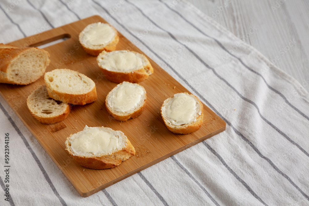 Homemade Bread and Butter on a bamboo board, side view.