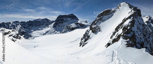 Large mountain panorama towards Bocktschingel and Piz Russein and the Clariden Glacier. Ski mountaineering in the Uri Alps. High quality photo