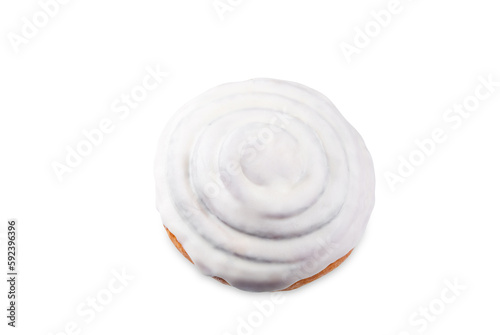 Cinnamon roll bun with cream glaze on a white isolated background
