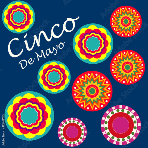 White text Cinco De Mayo and stylized colorful paper fans on the blue background. 