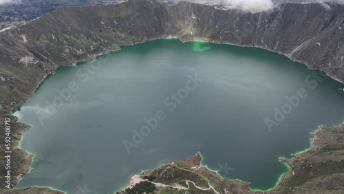 Aerial water-filled crater volcano lake  in the Ecuadorian Andes Mountains Mavic 3 cine drone 25fps prores Quilotoa  