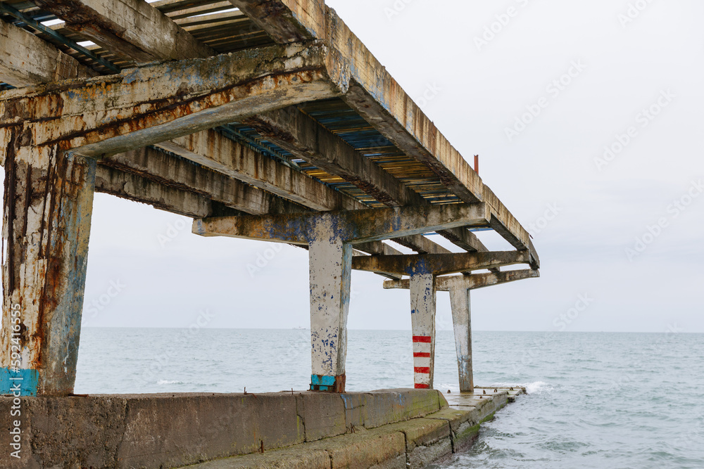 Abandoned bridge in the sea. Pier on the Black Sea in Sochi, Russia