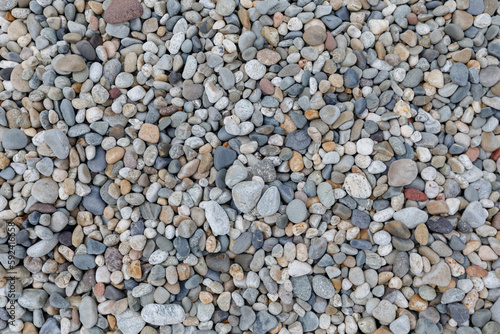 Pebbles background. Small pebbles on the beach.