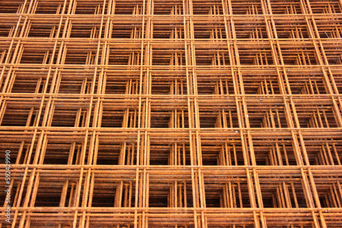 Rusty steel rebar grids, abstract construction backround