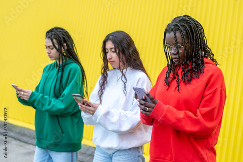 foreign friends autographing with their mobile phones in the street photo