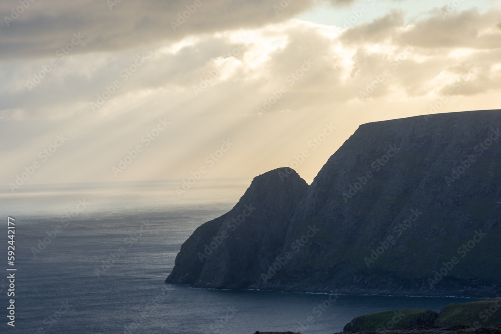 Beautiful sun beams over the North Cape cliff and the Arctic Ocean,  Norway