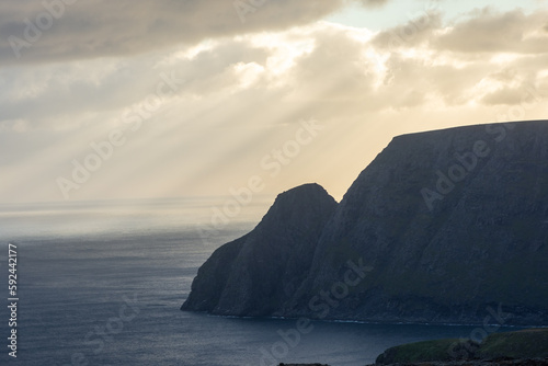Beautiful sun beams over the North Cape cliff and the Arctic Ocean   Norway