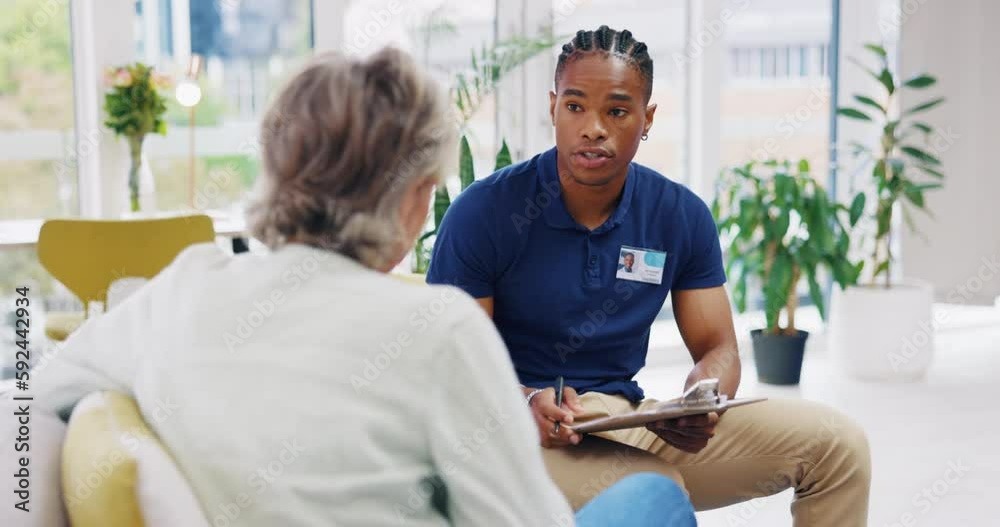 Retirement, documents and a nurse talking to an old woman patient about healthcare in an assisted living facility. Medical, planning and communication with a black man consulting a senior in her home Retirement, documents and a nurse talking to an old woman patient about healthcare in an assisted living facility. Medical, planning and communication with a black man consulting a senior in her home