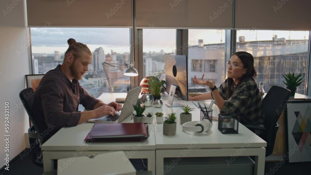 Overworked programmers talking at office closeup. Teammates preparing deadline Overworked programmers talking at office closeup. Teammates preparing deadline