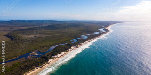Aerial (drone) view of a spectacularly beautiful long Ten Mile Beach and Pacific ocean, near Byron bay, Black rocks campground, NSW, Australia