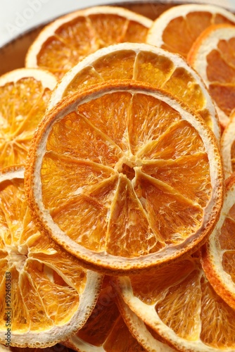 Bowl of dry orange slices, closeup view