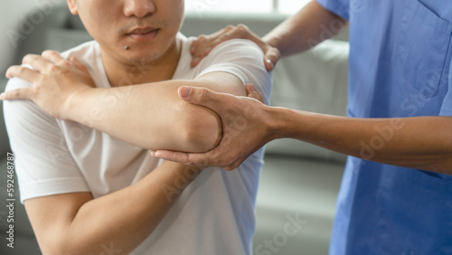 Athlete undergoing physiotherapy with a musculoskeletal specialist after sports and gym injuries.