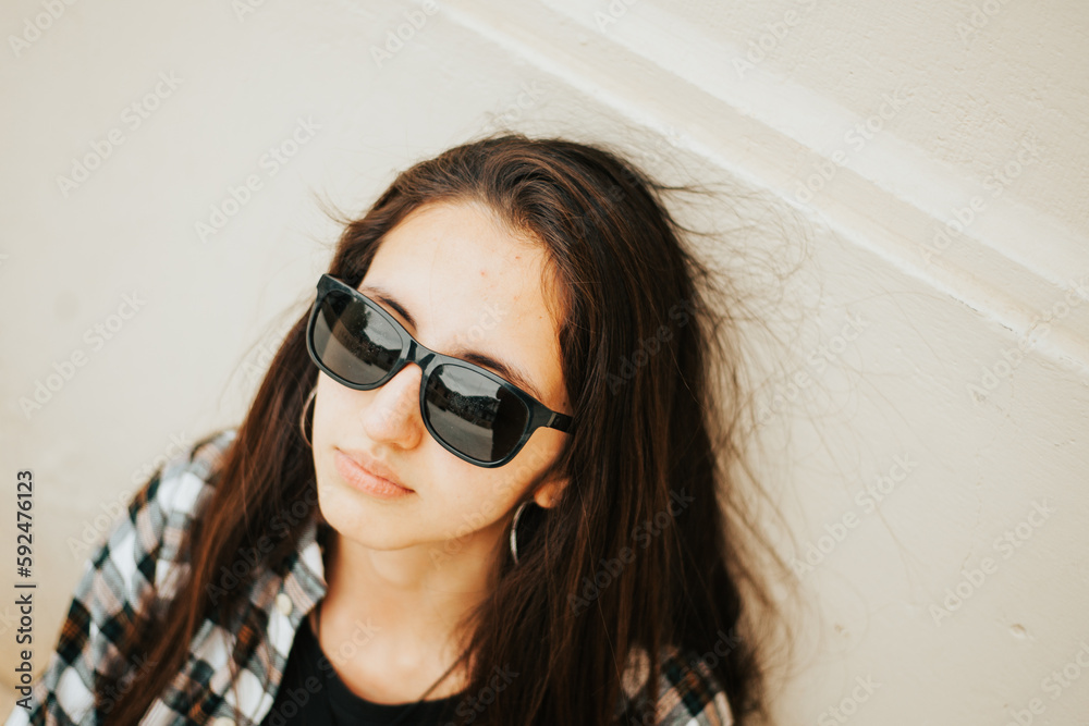 photo of young girl wearing sunglasses (portrait). Lifestyle concept and people. photo of young girl wearing sunglasses (portrait). Lifestyle concept and people.