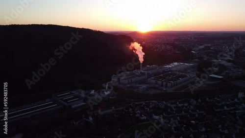 Drone shot of industrial zone with thick smog and burning fossil fuels. 