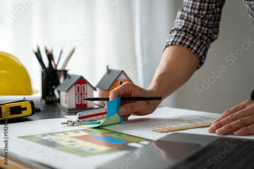 Εκτύπωση καμβά Engineers, architects, contractors look and choose color schemes to lay out proper house plans on blueprints at desk with ruler in office at construction site to design housing plan