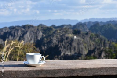 Morning coffee and the wonderful limestone mountains view in Khammouane province, central Laos