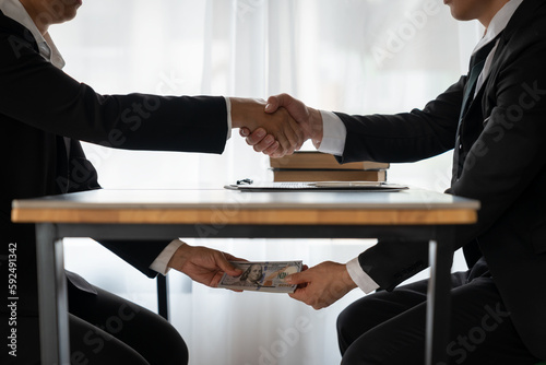 business people shaking hands and Give an under-the-table bribe to an attorney to help a lawyer win a court case. Bribery and Kickback Ideas Fraud and Fraud