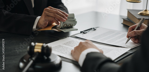 Government tax officials, legal advisers taking bribes of citizens wrapped in brown envelopes. Opening the annual tax evasion, the concept of bribing tax evader officials.