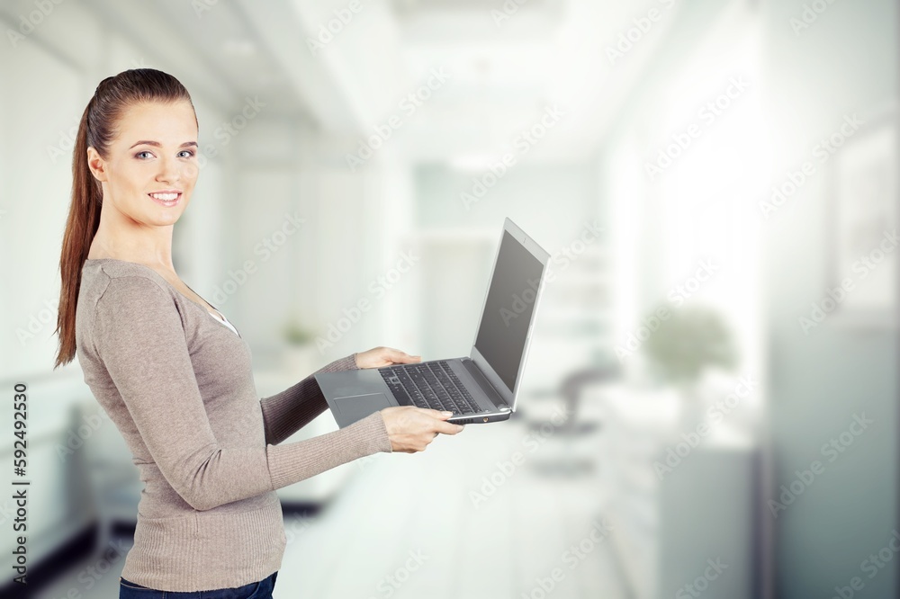 Young business female employee working in office Young business female employee working in office