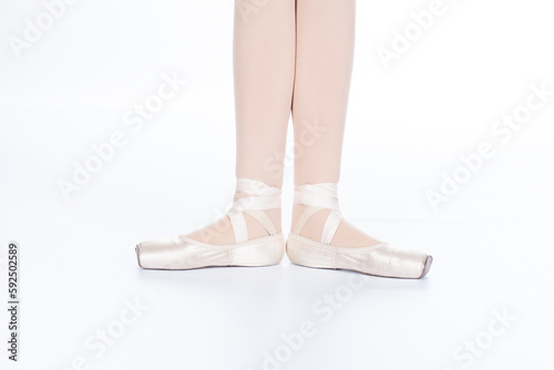 En Pointe CORRECT First position open calves touching front on teachers perspective showing calves touching Young female ballet dancer showing various classic ballet feet positions pointe shoes