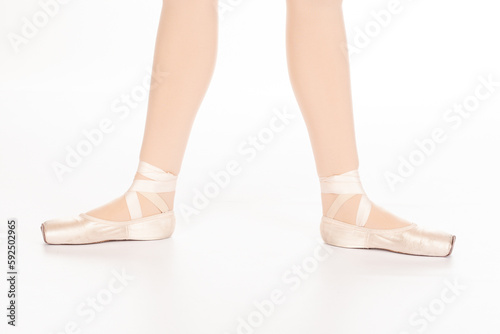 En Pointe CORRECT Second position showing calves front on teachers perspective Close up of young female ballet dancer showing various classic ballet feet positions pointe