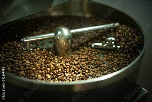 Freshly roasted coffee beans in a roaster